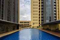 Swimming Pool Elegant 1BR Branz BSD Apartment By Travelio