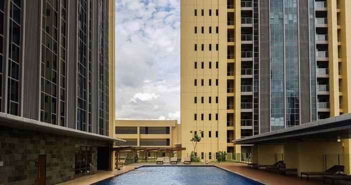 Swimming Pool Elegant 1BR Branz BSD Apartment By Travelio