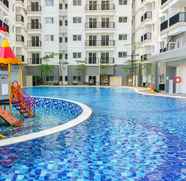 Swimming Pool 4 Comfy Living at 2BR Signature Park Grande Apartment By Travelio