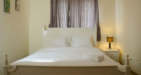 Bedroom 2 Luxury Design 3BR Apartment Grand Palace Kemayoran By Travelio