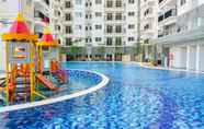 Swimming Pool 4 Warm and Cozy 2BR Park Signature Grande Apartment By Travelio