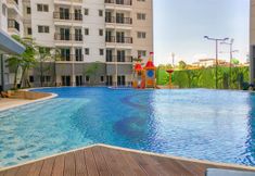Swimming Pool 3 Warm and Cozy 2BR Park Signature Grande Apartment By Travelio