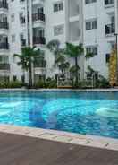 SWIMMING_POOL Warm and Cozy 2BR Park Signature Grande Apartment By Travelio