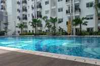 Swimming Pool Warm and Cozy 2BR Park Signature Grande Apartment By Travelio