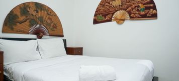 Bedroom 5 3BR Luxurious and Elegant at Vittoria Apartment By Travelio