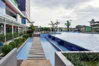 Swimming Pool Homey 2BR Aparment at Green Pramuka near Mall By Travelio