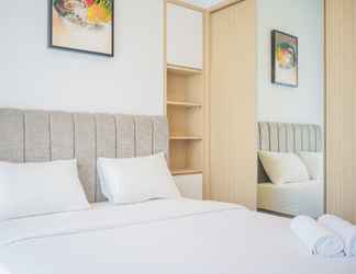 Bedroom 2 Comfy 1BR Apartment at Marigold Nava Park By Travelio