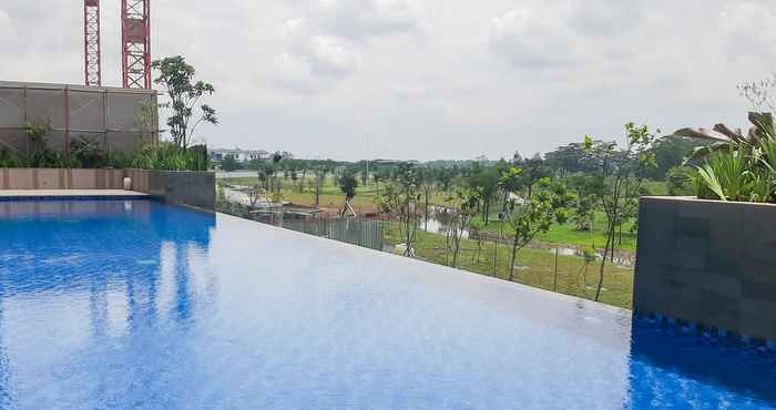 Kolam Renang Comfy 1BR Apartment at Marigold Nava Park By Travelio