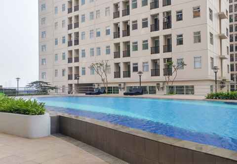 Swimming Pool 2BR Homey Ayodhya Residence Apartment By Travelio