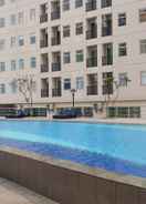 SWIMMING_POOL 2BR Homey Ayodhya Residence Apartment By Travelio