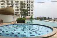 Swimming Pool 2BR Full Parquette at Cinere Bellevue Apartment By Travelio