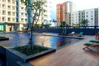 Swimming Pool 4 Simply Spacious 1BR at Green Bay Condominium Apartment By Travelio