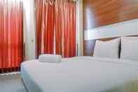 Kamar Tidur Cozy Studio Room at Tamansari Papilio Apartment By Travelio