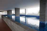 Swimming Pool Studio Room Simple at Poris 88 Apartment By Travelio