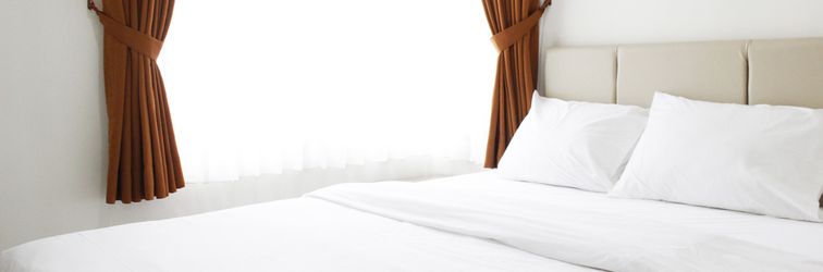 Lobby 2BR Cozy Apartment at Newton Residence By Travelio