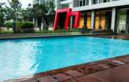 Swimming Pool 6 1BR Monochrome at Lexington Apartment By Travelio