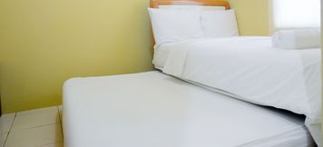 Bedroom 6 2BR Comfy Green Bay Pluit Apartment By Travelio