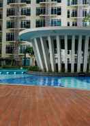 SWIMMING_POOL Homey 1BR Puri Orchard Apartment By Travelio