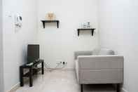 Lobby Homey 1BR Puri Orchard Apartment By Travelio