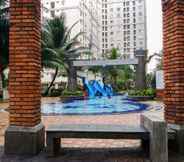 Swimming Pool 3 2BR Homey Green Palace Kalibata Apartment By Travelio