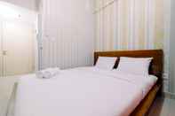 Bedroom Cozy Studio Apartment at Springlake Summarecon Bekasi By Travelio