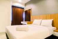 Bilik Tidur Studio Cozy Grand Kamala Lagoon Apartment By Travelio