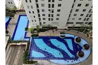 Swimming Pool Best 2BR Bassura City Apartment By Travelio