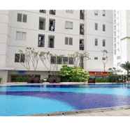 Swimming Pool 4 Best 2BR Bassura City Apartment By Travelio