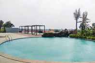 Swimming Pool 2BR Luxury Furnished at Grand Kamala Lagoon Apartment By Travelio