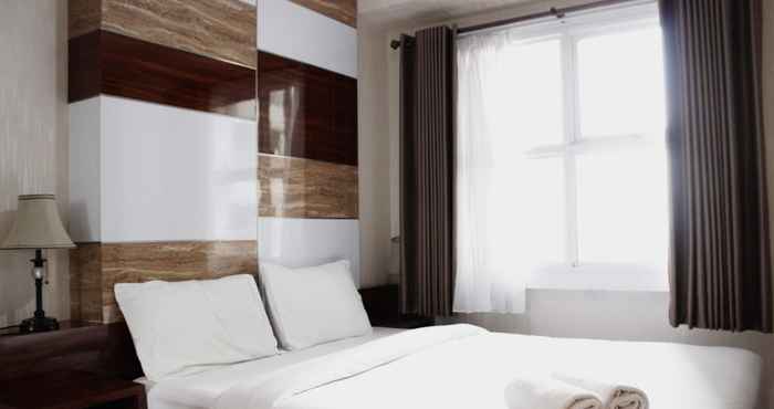 Bedroom Comfy 1BR Parahyangan Residence Apartment By Travelio