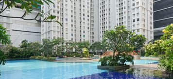 Swimming Pool 2 2BR Spacious Green Bay Pluit Apartment By Travelio