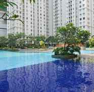 Swimming Pool 2 2BR Spacious Green Bay Pluit Apartment By Travelio