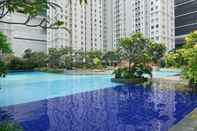 Swimming Pool 2BR Spacious Green Bay Pluit Apartment By Travelio