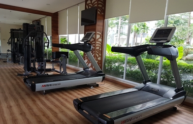 Fitness Center 2 1BR Cozy Unit Saveria Apartment By Travelio