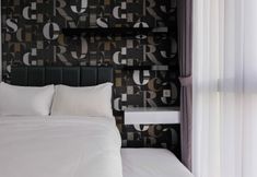 Bedroom 2 3BR Apartment with Pool at M-Town Signature By Travelio