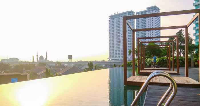 Swimming Pool Studio Cozy Apartment @ Grand Kamala Lagoon By Travelio