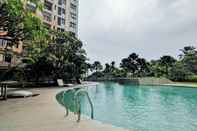 Swimming Pool 2BR Cozy with Sofa Bed Cervino Tebet Apartment By Travelio