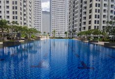 Swimming Pool 2 Comfortable 2BR M-Town Residence Apartment By Travelio