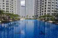 Swimming Pool Comfortable 2BR M-Town Residence Apartment By Travelio