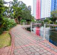 Lobby 5 Relaxing 2BR Green Pramuka Apartment By Travelio