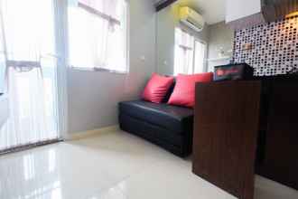 Common Space 4 Relaxing 2BR Green Pramuka Apartment By Travelio