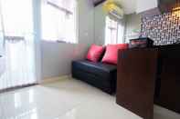 Common Space Relaxing 2BR Green Pramuka Apartment By Travelio