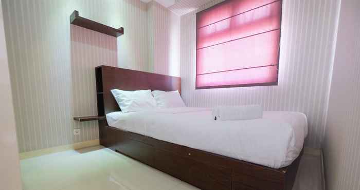 Bedroom Relaxing 2BR Green Pramuka Apartment By Travelio