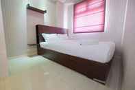 Bedroom Relaxing 2BR Green Pramuka Apartment By Travelio