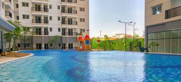 Swimming Pool 2 Affordable 1BR Signature Park Grande Apartment By Travelio