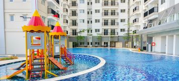 Swimming Pool 3 Affordable 1BR Signature Park Grande Apartment By Travelio