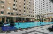 Swimming Pool 5 Homey Emerald 2BR Gading Nias Residences Apartment By Travelio