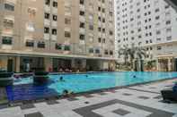 Swimming Pool Homey Emerald 2BR Gading Nias Residences Apartment By Travelio