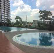 Swimming Pool 4 Cozy 1BR Apartment at Oasis Cikarang By Travelio