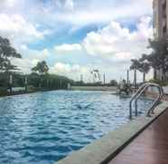 Swimming Pool 2 Cozy 1BR Apartment at Oasis Cikarang By Travelio